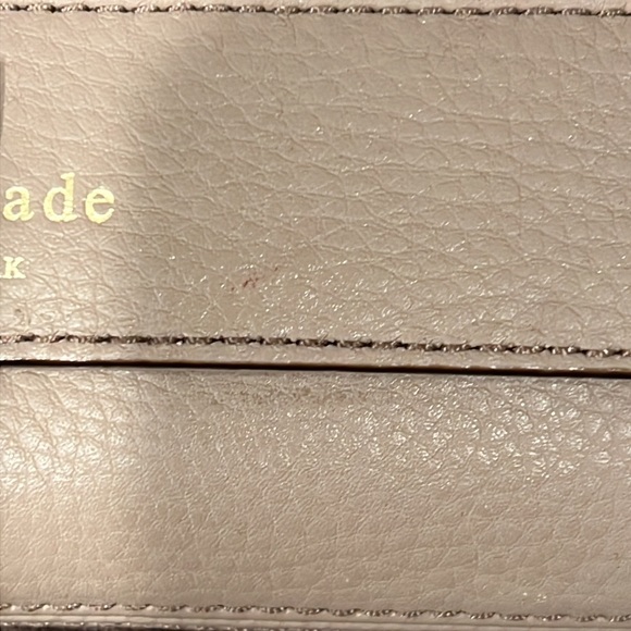 Kate Spade clutch in a taupe leather with laser cutout design. - Picture 4 of 5